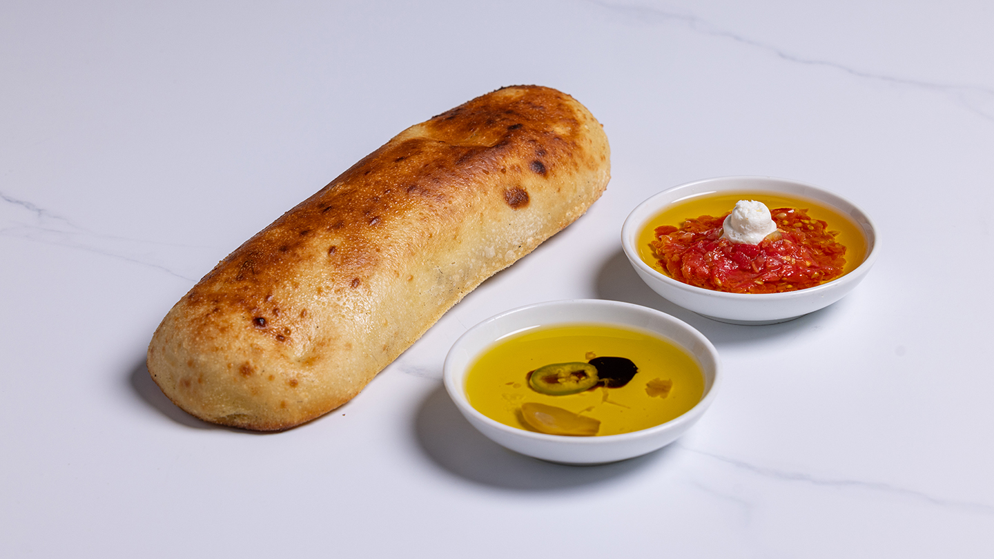 פוקאצ׳ה ומטבלים — צילום מעמוד המקור